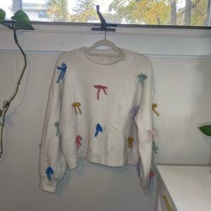 White Sweater with Multicolored Bow Detail